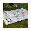 Custom foldable picnic mat tote bag opened on grass as a 100 x 150 cm padded picnic mat