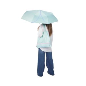 Custom umbrella tote bag in mint green carried as a shoulder tote with the folding umbrella open, Malaysia