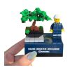 Custom brick bonsai desk display with minifigure in coveralls and printed slogan base