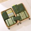 Custom packing cubes packed into an open suitcase with mesh tops showing folded clothes, Malaysia