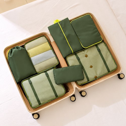Custom packing cubes packed into an open suitcase with mesh tops showing folded clothes, Malaysia