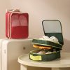 Custom travel shoe case slid onto a suitcase handle beside an open olive case, Malaysia