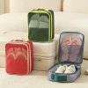 Custom travel shoe organiser in three colours beside a cabin suitcase, Malaysia